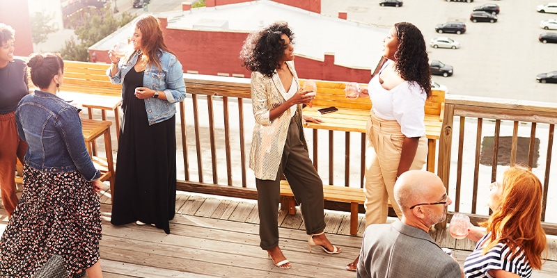 Group Of People On The Rooftop Deck