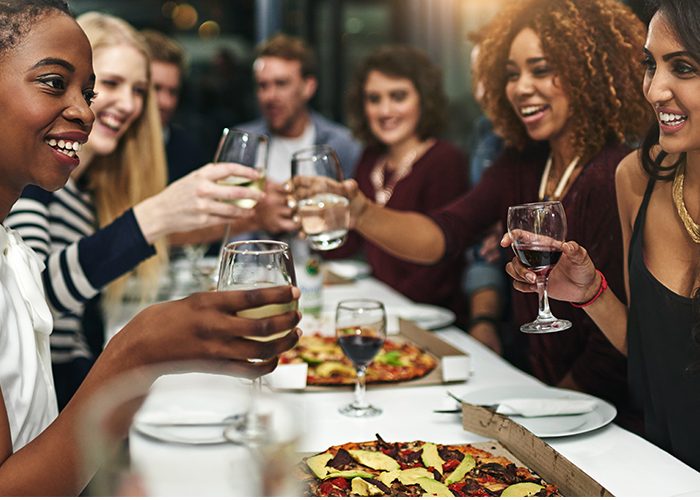 Photo Of Happy People Holding A Wine Glass