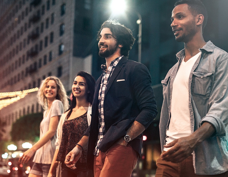 a group of people standing in the street