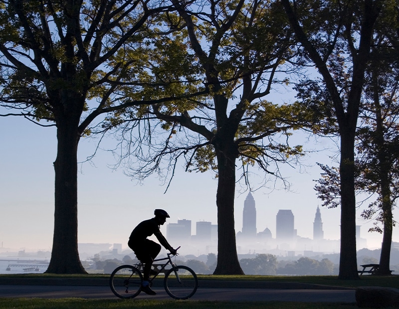 a man riding on the back of a bicycle